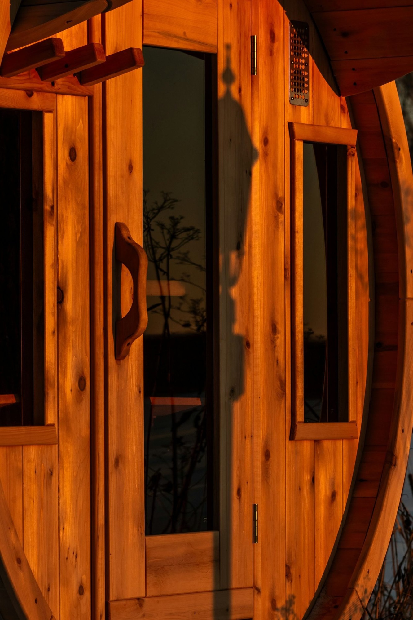 Cedar barrel sauna door with glass panels, built in Napa